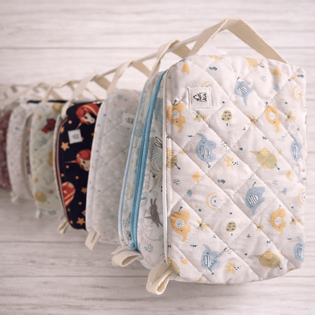astucci in tessuto trapuntato con zip e manico, fantasie colorate fatti a mano